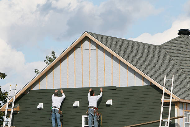 Professional Storm Damage Siding Repair technician working in Howard, PA